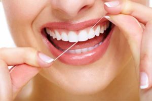 Beautiful Woman Flossing Healthy White Teeth — Crest Hill, IL — Crest Hill Family Dental